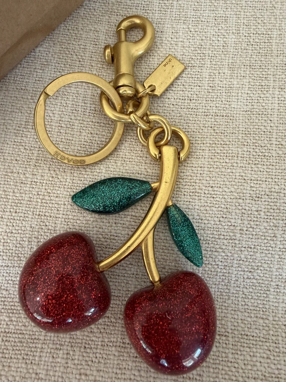 Coach Gold-Tone Cherry Keyring with Red Enamel Cherries and Green Leaves